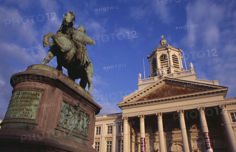 BELGIUM, Brabant, Brussels, Royal Square.  Exterior facade of Church of Saint James with equestrian statue of Godfrey of Bouillon leader of the first crusade in 1096 in foreground.