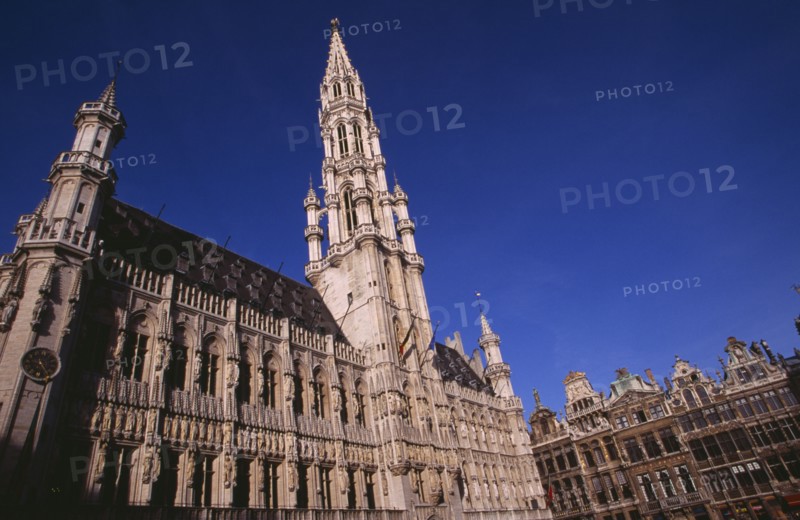 BELGIUM, Brabant, Brussels, The Grand Place.  Hotel de Ville.  Angled view of exterior facade decorated with statues representing the Dukes and Duchessess of Brabant.