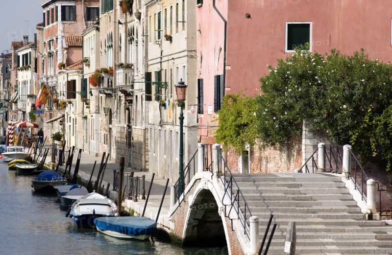 ITALY, Veneto, Venice, A bridge and colourful houses beside a canal on Fondamente della Sensa in Cannaregio district
