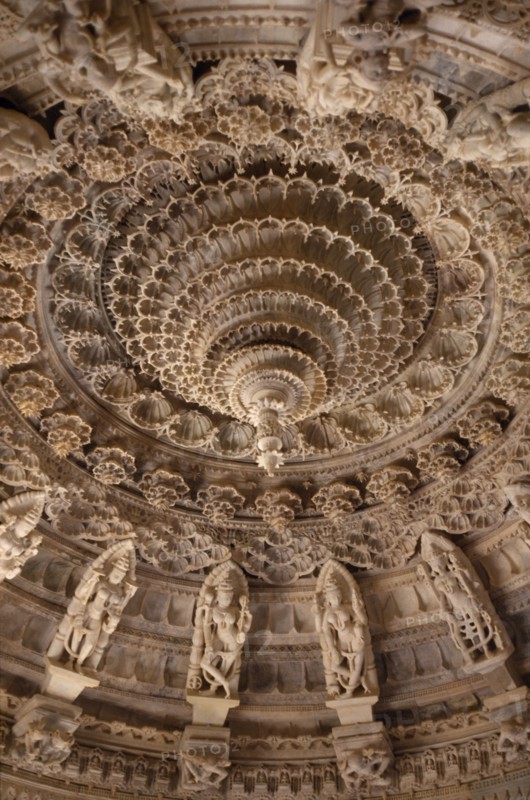INDIA, Rajasthan, Mount Abu, Dilwara Temples. Vimal Vasahi Jain temple 1031 A.D. Detail of carved white marble central ceiling with central pendant tapered to form point like a lotus flower.