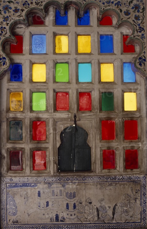 INDIA, Rajasthan, Udaipur, Stained glass window and decorated surround.