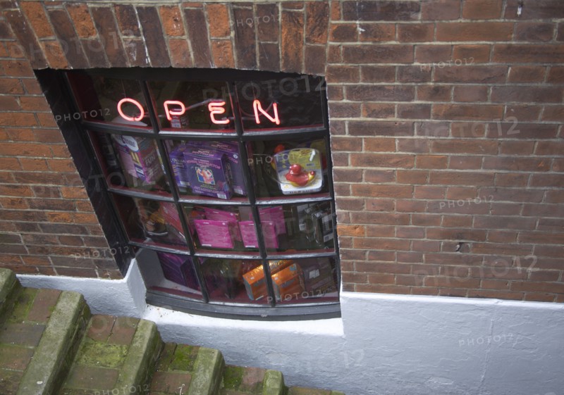 ENGLAND, East Sussex, Brighton, Basement sex shop selling marital aids in a tiny alleyway in the Lanes area.