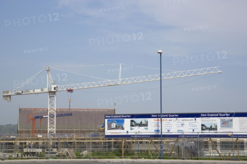 ENGLAND, East Sussex, Brighton, Construction crane in the New England quarter next to railway station.