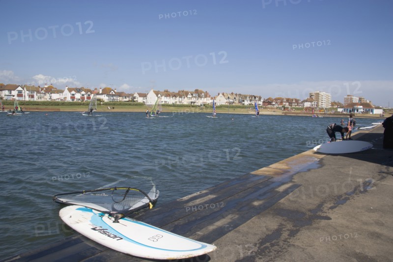 ENGLAND, East Sussex, Brighton, Hove lagoon with windsurfers