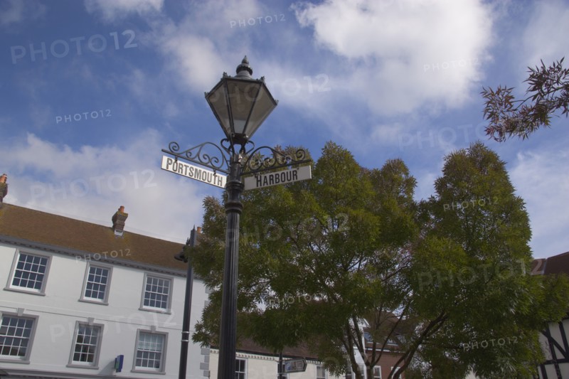ENGLAND, Hampshire, Emsworth, Main square with signs pointing to Portsmouth and the Harbour.