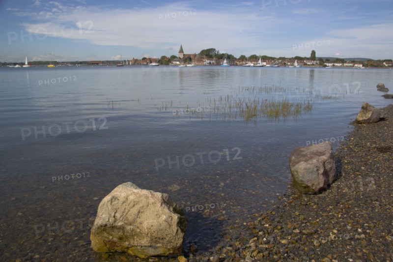 ENGLAND, West Sussex, Bosham, View across water toward Old Bosham with the church spire visible