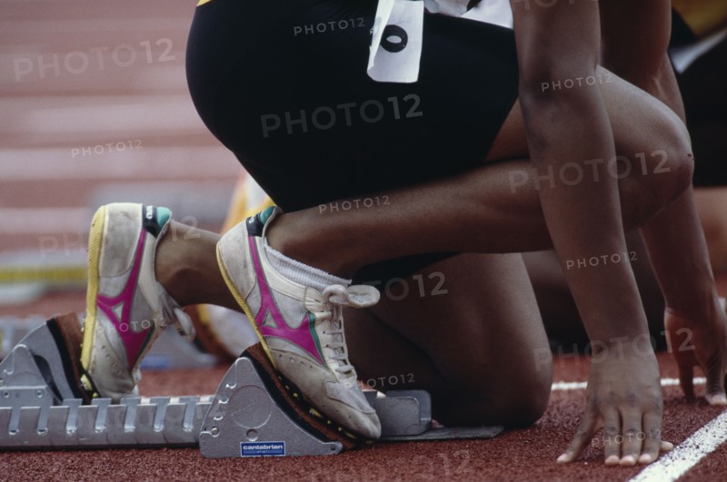 SPORT, Athletics, Male Track, Cropped view of runner on starting blocks at the start of 100 m event.