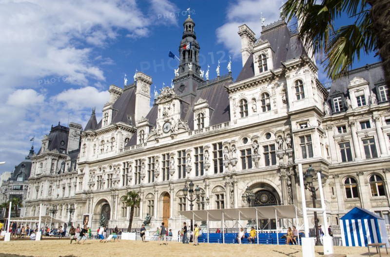 FRANCE, Ile de France, Paris, The Paris Plage urban beach. Young people playing beach rugby football in front of the Hotel de Ville Town Hall