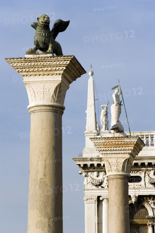 ITALY, Veneto, Venice, The winged Lion of Saint Mark on the Column San Marco with the Column of San Teodoro beyond in the Piazzatta