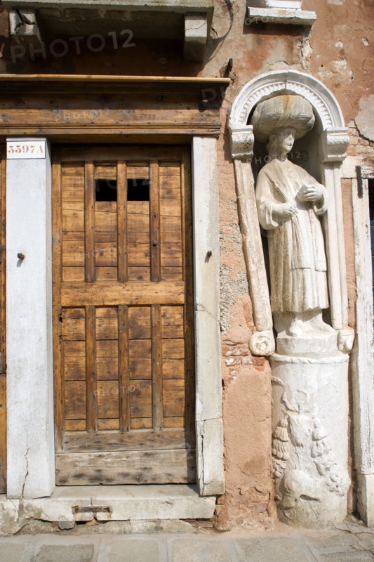ITALY, Veneto, Venice, A stone figure of a Moor beside Tintoretto's house on Fondamenta dei Mori in the Cannaregio district