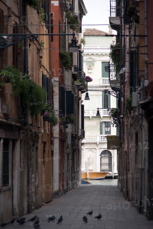 ITALY, Veneto, Venice, View down a narrow street to the Grand Canal in the San Polo and Santa Croce district