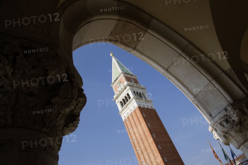 ITALY, Veneto, Venice, The Campanile in Piazza San Marco seen through an arch below the Doges Palace