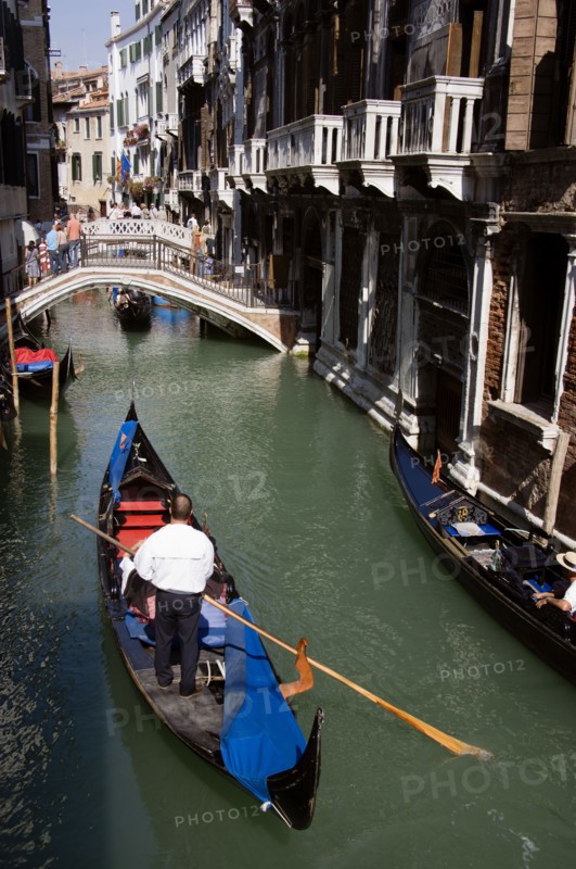 ITALY, Veneto, Venice, Gondolas with tourists passing along the Rio del Palazzo canal with its many small pedestrian bridges