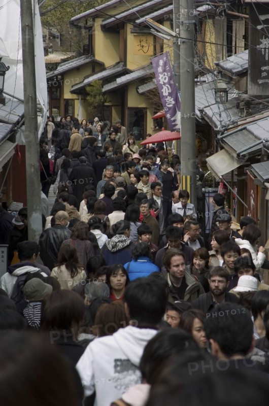 JAPAN, Honshu, Kyoto, Crowded lane in Sannen-zaka - wooden houses shops teahouses and tourists