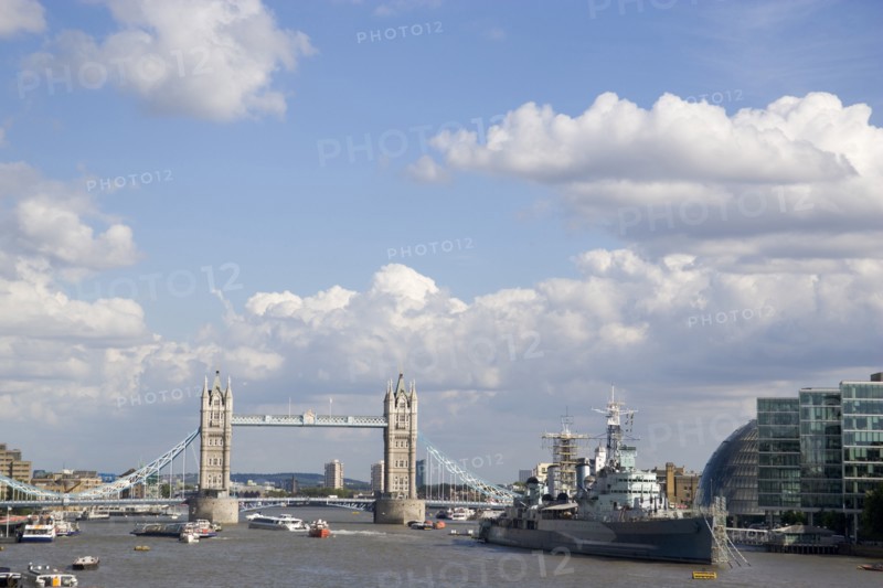 ENGLAND, London, View along the river Thames from London Bridge toward HMS Belfast and Tower Bridge.