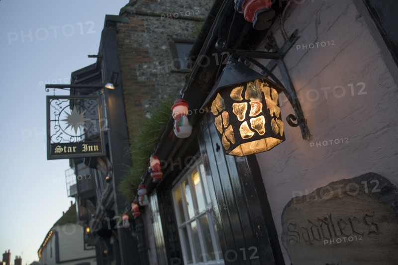 ENGLAND, East Sussex, Alfriston, Lantern and sign outside the Star pub.