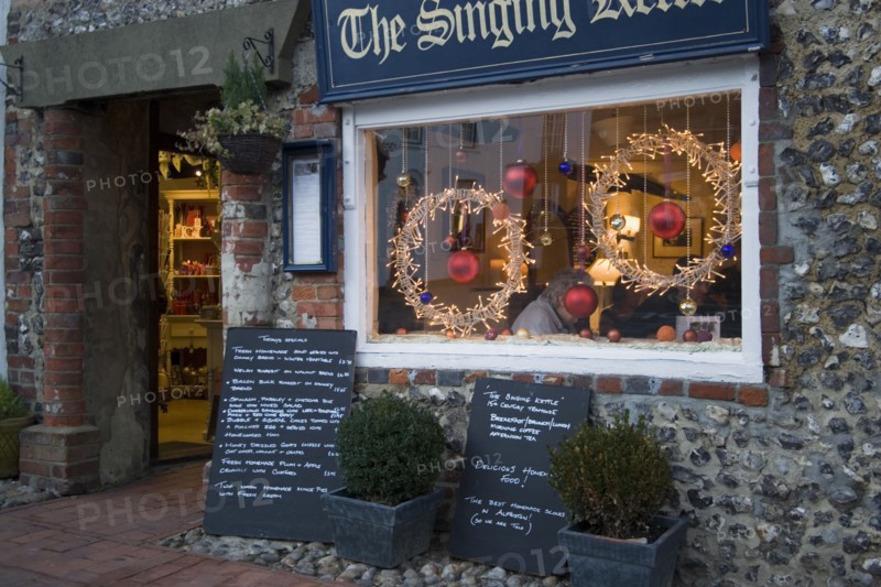 ENGLAND, East Sussex, Alfriston, Cafe with window decorated for Christmas.