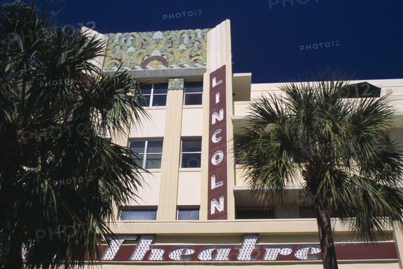 USA, Florida, Miami, South Beach. Lincoln Avenue. The Lincoln Theatre exterior with palm trees