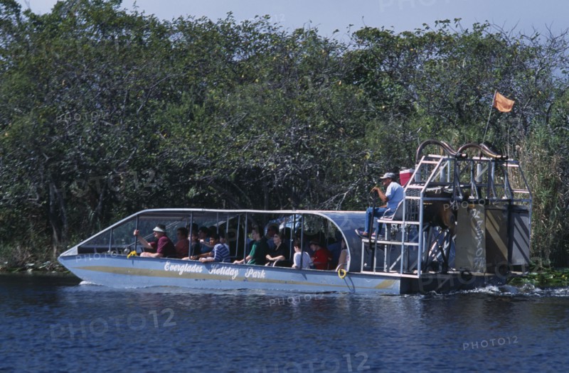 USA, Florida, Fort Lauderdale, Tourists Air boating in the Everglades National Park