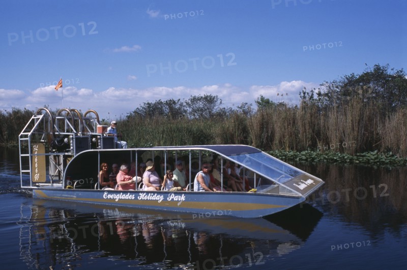 USA, Florida, Fort Lauderdale, Tourists Air boating in the Everglades National Park