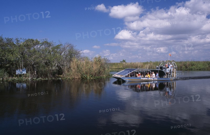 USA, Florida, Fort Lauderdale, Tourists Air boating in the Everglades National Park