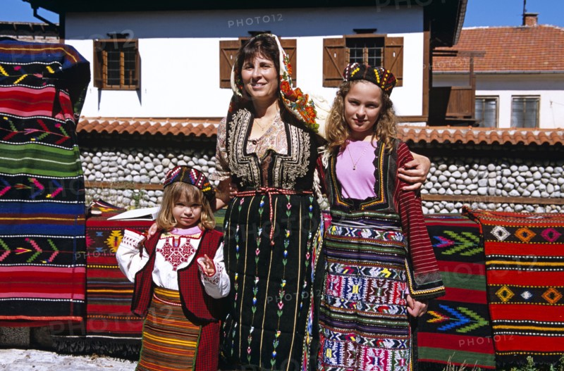 BULGARIA, Bansko, Mother and daughters wearing national costume