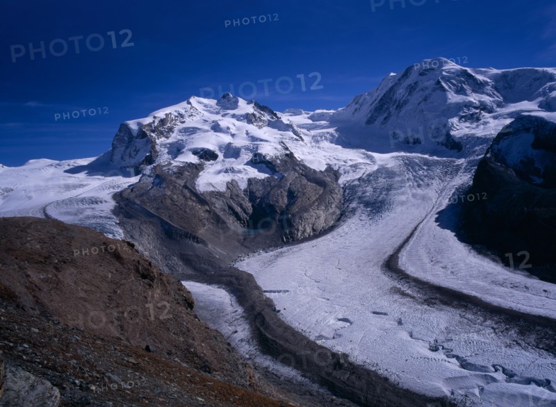 SWITZERLAND, Valais, Monte Rosa Mountains, "Snow covered mountains left to right, Dufourspitze 4545metres ( 14885 ft )  Liskam 4479metres ( 14668 ft ) Grenz Glacier right centre"