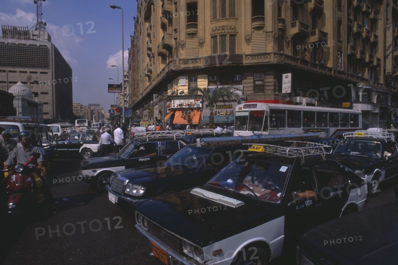 EGYPT, Cairo Area, Cairo, "Busy road with traffic including buses, taxis and motorbikes"