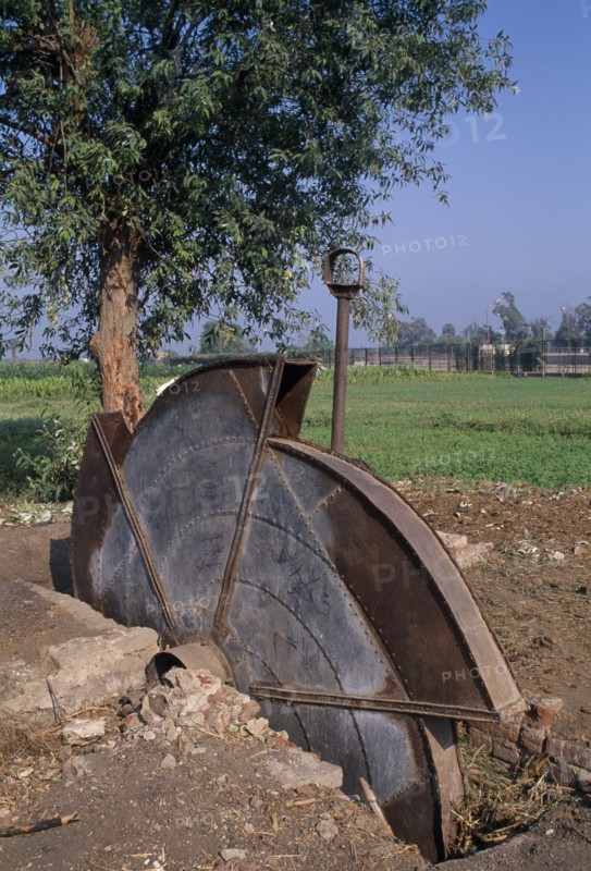EGYPT, Agriculture , A disused water pump with fields behind