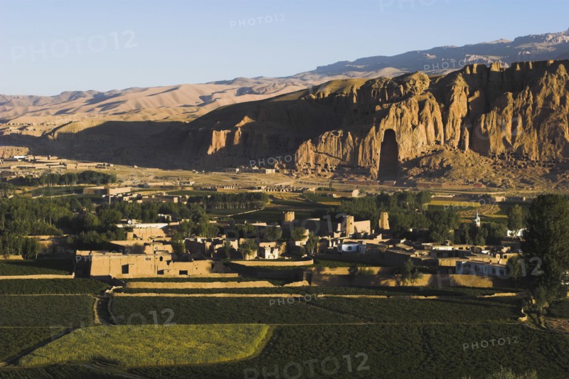 AFGHANISTAN, Bamiyan Province, Bamiyan , View of Bamiyan valley and village showing cliffs with empty niche where the famous carved Budda once stood (destroyed by the Taliban in 2001)
