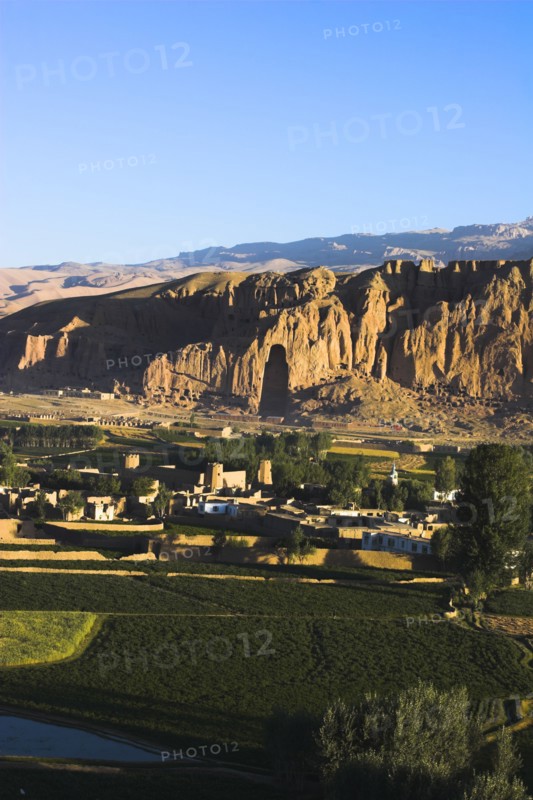 AFGHANISTAN, Bamiyan Province, Bamiyan , View of Bamiyan valley and village showing cliffs with empty niche where the famous carved Budda once stood (destroyed by the Taliban in 2001)