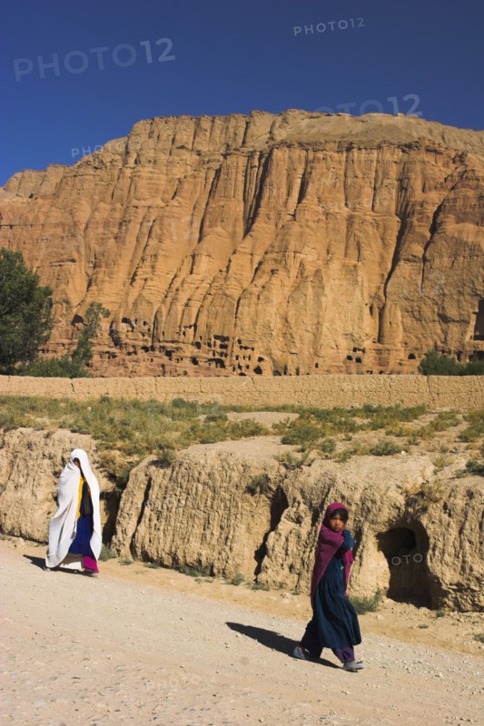 AFGHANISTAN, Bamiyan Province, Bamiyan , " Bamiyan, Remains of bazzar which was destroyed by the Taliban infront of empty niche where the famous carved Budda once stood (destroyed by the Taliban in 2001)"