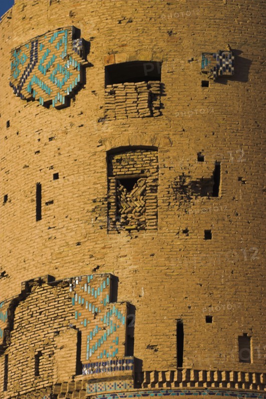 AFGHANISTAN, Herat, "Timurid tilework on a tower of The Citadel (Qala-i-Ikhtiyar-ud-din) Originally built by Alexander the Great but built in it's present form by Malik Fakhruddin in 1305 A.D. Conquerors Ghegnis Khan and Tamerlane fought beneath its walls and it suffered attacks by the Ghaznavids, the Seljuks, the Ghorids, the Monghuls, the Timurids the Safavids and others. Now managed by the department of Historical monuments of the Ministry of Information, Culture and Tourism"