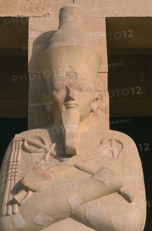 EGYPT, Nile Valley, Thebes, Deir-el-Bari. Hepshepsut Mortuary Temple. Hepshepsut statue reprenseted as a male with a beard and crossed arms bearing the crook and flail