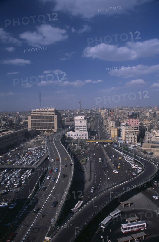 EGYPT, Cairo Area, Cairo, Elevated view over busy road network and tall city buildings