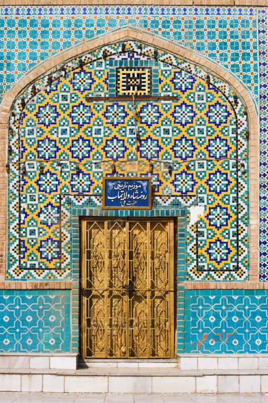 AFGHANISTAN, Mazar-I-Sharif, "Tiling round door, Shrine of Hazrat Ali (who was assissinated in 661) This shrine was built here in 1136 on the orders of Seljuk Sultan Sanjar, destroyed by Genghis Khan and rebuilt by Timurid Sultan Husain Baiqara in 1481, since restored. The shrine is famous for its white pigeons, it is said the site is so holy that if a grey pigeon flies here it will turn white within 40 day"