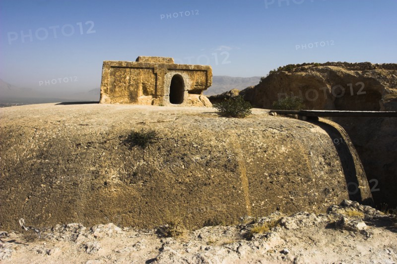 AFGHANISTAN, Samangan Province, Top-I-Rustam, "2km south of the centre of Haibak, Buddhist stupa carved out of rock known as Top-I-Rustam (Rustam's throne) an early burial mound that contained relics of the Buddha, part of a stupa-monastery complex carved from rock dating from the Kushano-Sasanian period 4th-5th century AD. The stupa is situated above caves where the monks lived  Jane Sweeney"