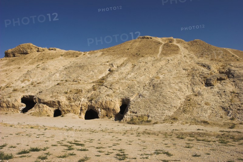 AFGHANISTAN, Samangan Province, Takht-I-Rusam, "2km south of the centre of Haibak, Buddhist caves know as Takht-I-Rusam (Rustam's throne), part of a stupa-monastery complex caeved from rock dating from the Kushano-Sasanian period 4th-5th century AD.