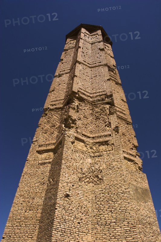 AFGHANISTAN, Ghazni, "Minaret of Bahram Shah, one of two early 12th Century Minarets the other built by Sultan Mas'ud 111, believed to have served as models for the Minaret of Jam, has square Kufic and Noshki script, Mounds at the foot of both minarets indicate they were once a part of two large buildings, archchaeologists believe these building were mosques"