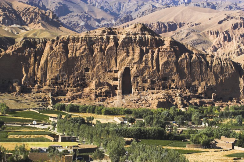 AFGHANISTAN, Bamiyan Province, Bamiyan, View of Bamiyan valley and village showing cliffs with empty niche where the famous carved Budda once stood (destroyed by the Taliban in 2001)