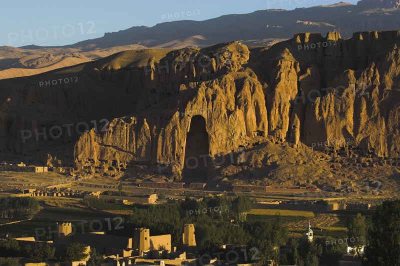 AFGHANISTAN, Bamiyan Province, Bamiyan, View of Bamiyan valley and village showing cliffs with empty niche where the famous carved Budda once stood (destroyed by the Taliban in 2001)