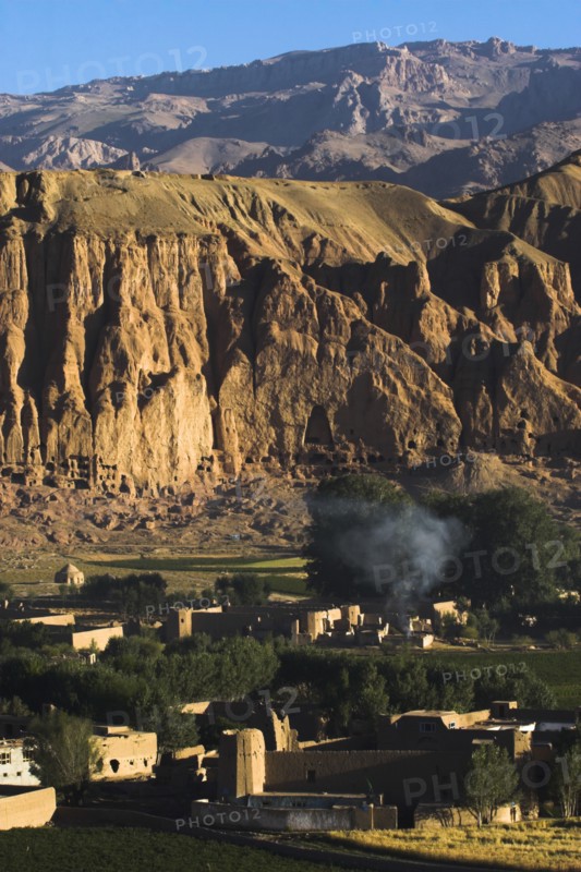 AFGHANISTAN, Bamiyan Province, Bamiyan, Village at base of cliffs near empty niche where the famous carved Budda once stood (destroyed by the Taliban in 2001