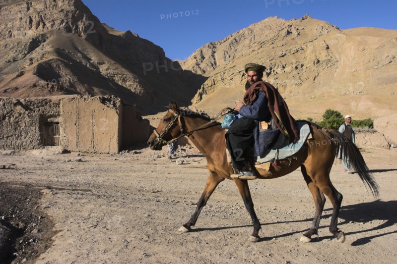 AFGHANISTAN, Ghor Province, Pal-Kotal-i-Guk, "Aimaq man riding horse