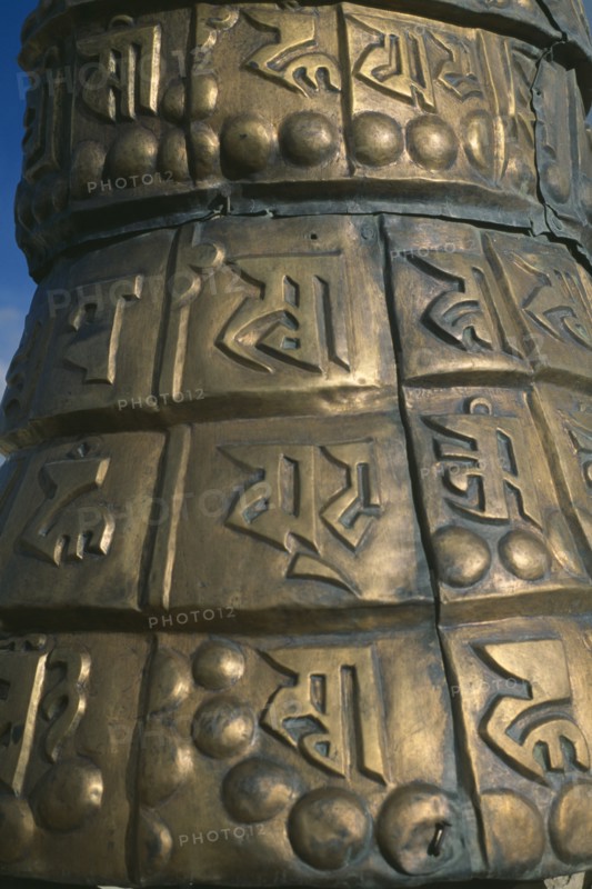 NEPAL, Mustang, Lo Manthang, Detail of elaborate bronze base of prayer flag on roof of the royal palace.