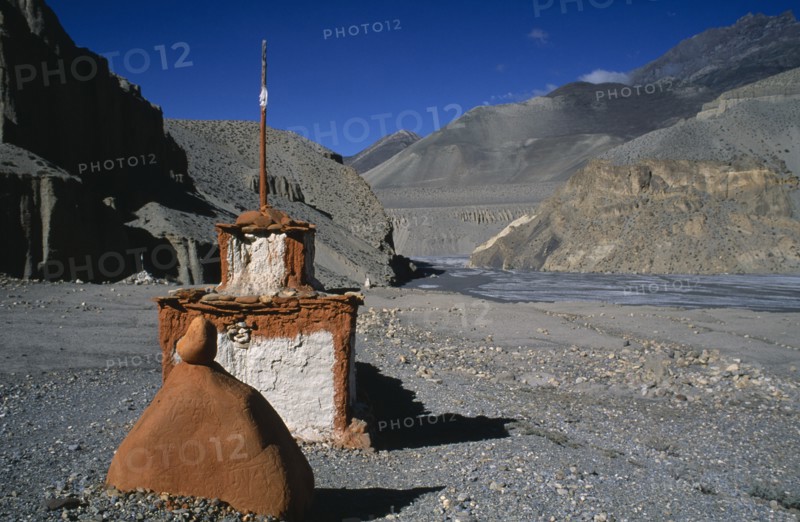 NEPAL, Mustang, Landscape, Stupa and sacred stones to protect travellers from the perils of the journey. Rtnd 2 VKB 15/5/2009