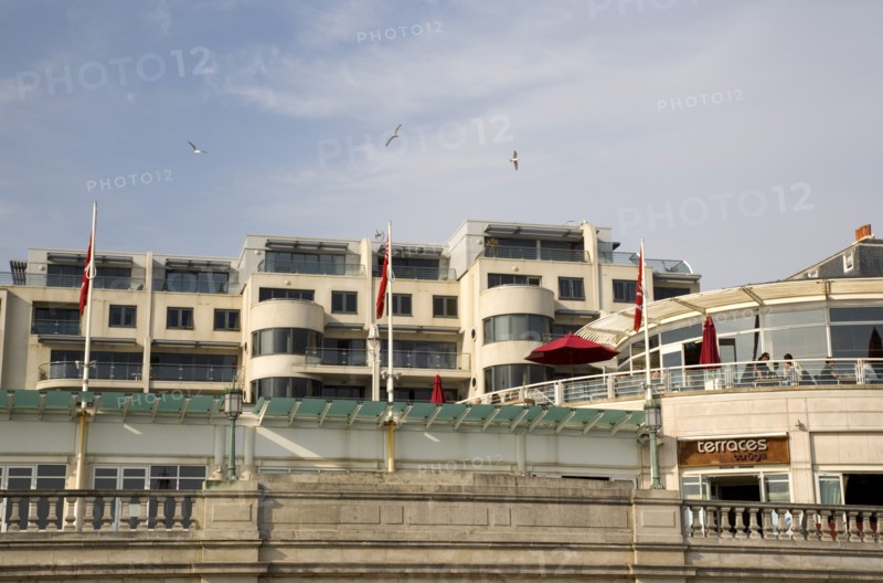 ENGLAND, East Sussex, Brighton, Modern seafront aprtments and restaurants on Marine Parade.