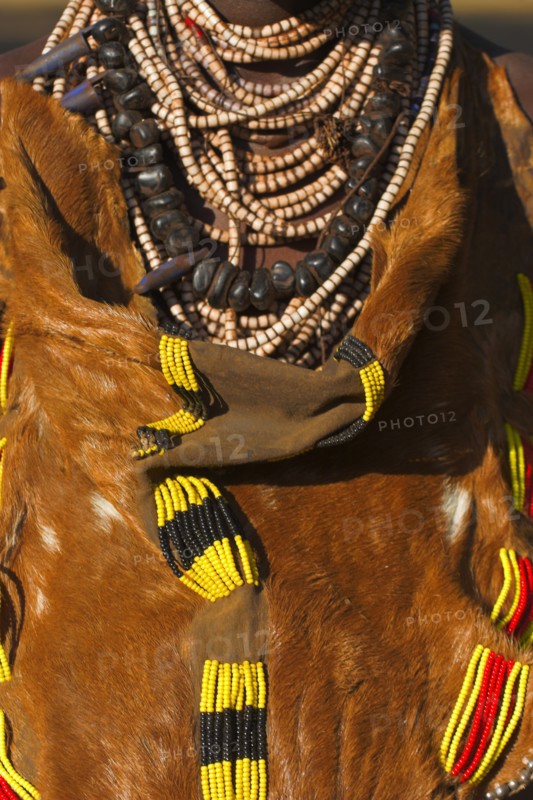 ETHIOPIA, Lower Omo Valley, Mago National Park, Womans traditional goatskin dress
