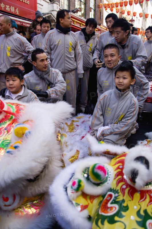 ENGLAND, London, Chinatown, Lion Dance troupe in Gerrard Street with their lions before performing through the area during Chinese New Year celebrations in 2006 for the coming Year of The Dog