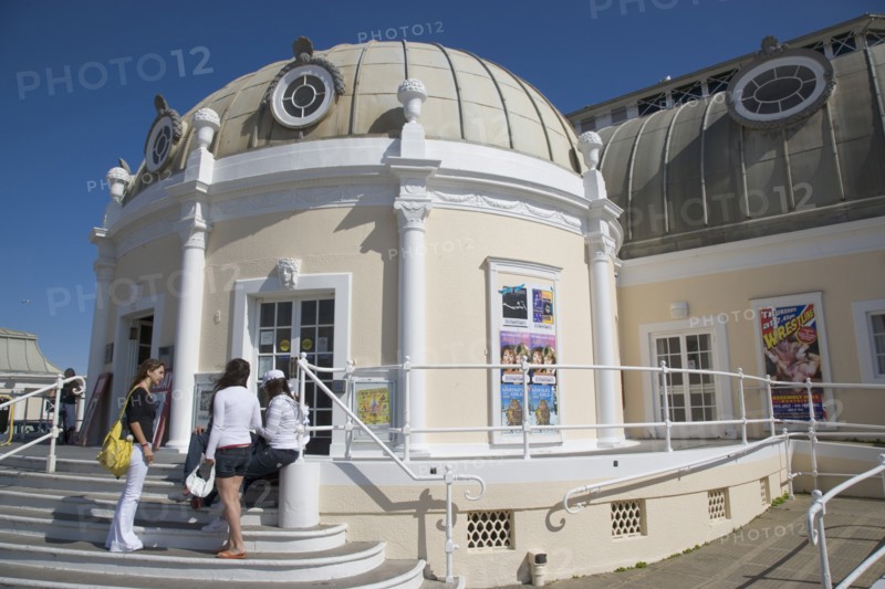 ENGLAND, West Sussex, Worthing, The Pavilion Theatre exterior with a group of girls on the steps outside.