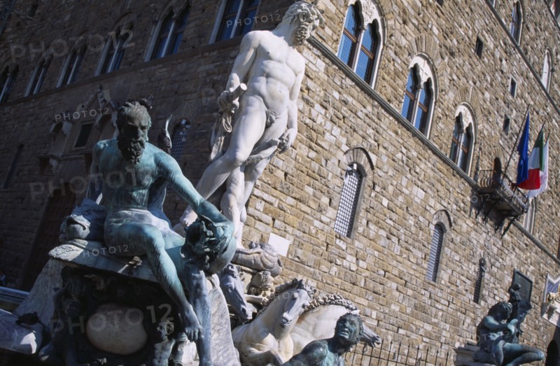 ITALY, Tuscany, Florence, Piazza della Signoria. Palazzo Vecchio behind The Fountain of Neptune